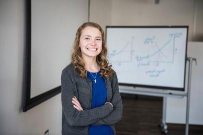 Female business student posing indoors.